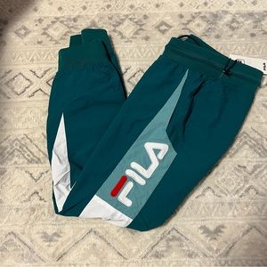 brand new with tags fila teal windbreaker cuffed pants
size medium mens